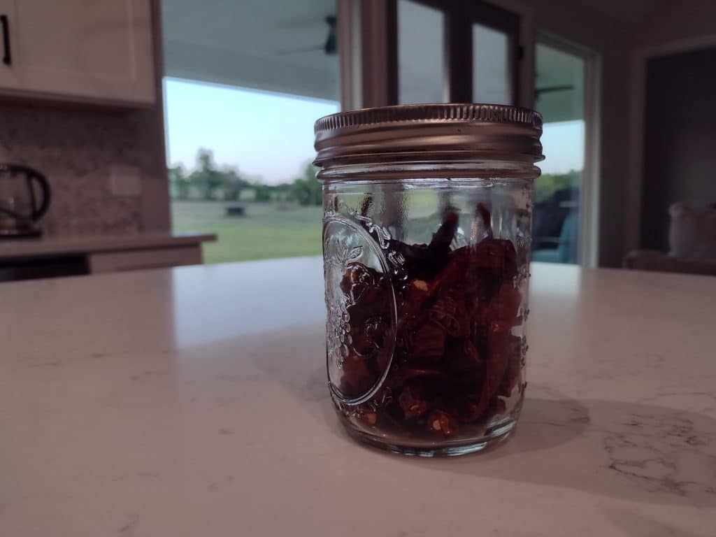 mason jar with dehydrated red peppers