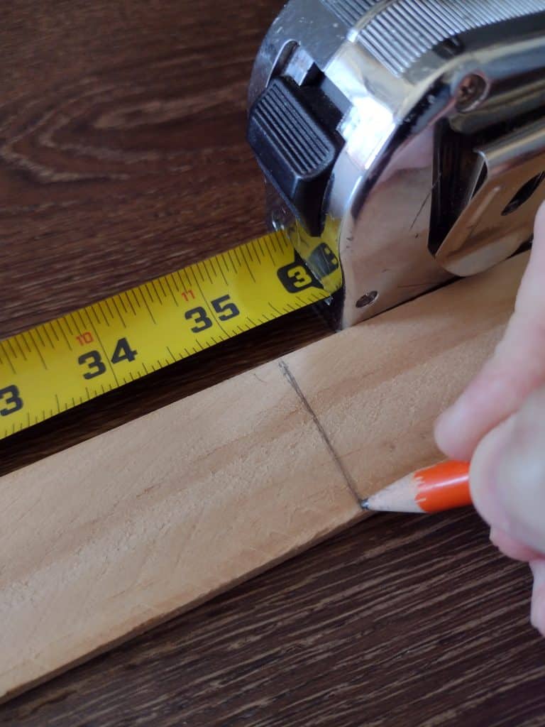 measuring the strip of wood